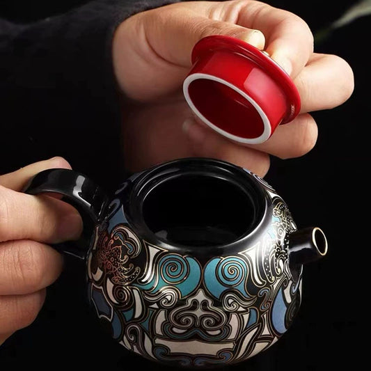 Single Kung Fu ceramic tea set with the technique of inlaying gold and silver and the pattern of Taotie